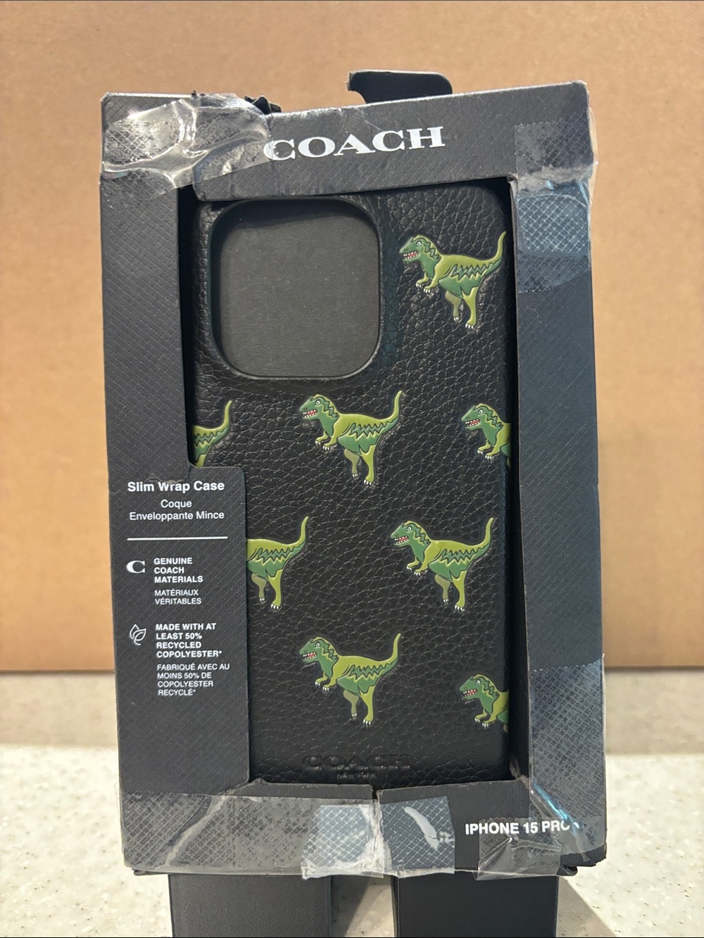 Coach Black Leather iPhone 15 Pro Case with Green Dinosaur Print